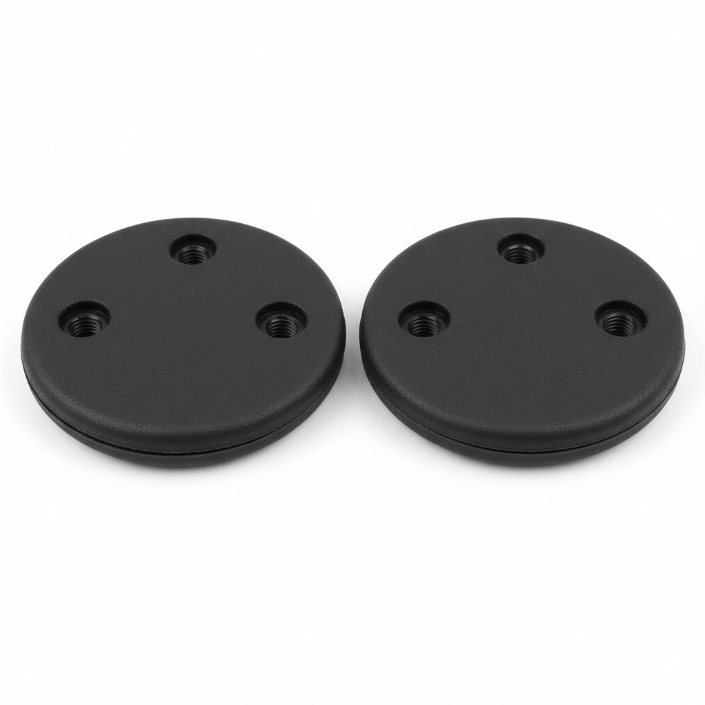 Plain black motorcycle knee slider replacement puck set, front view on white background