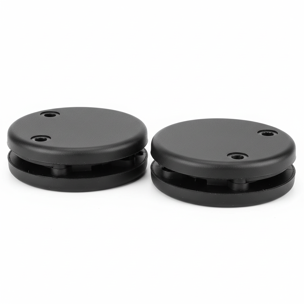 Plain black motorcycle knee slider replacement puck set, three-quarter rear view on white background