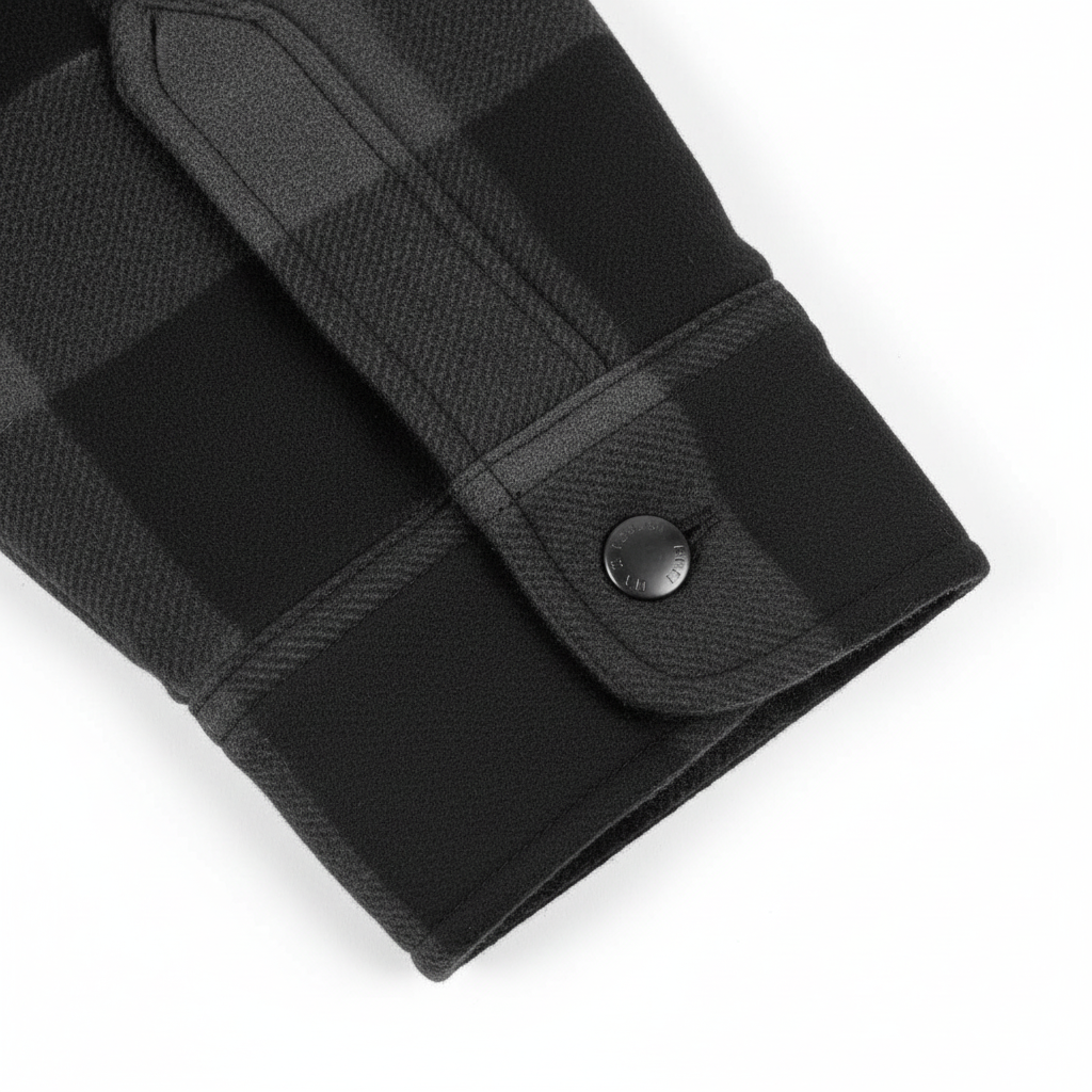 Cuff and snap fastening detail on unbranded motorcycle riding shirt