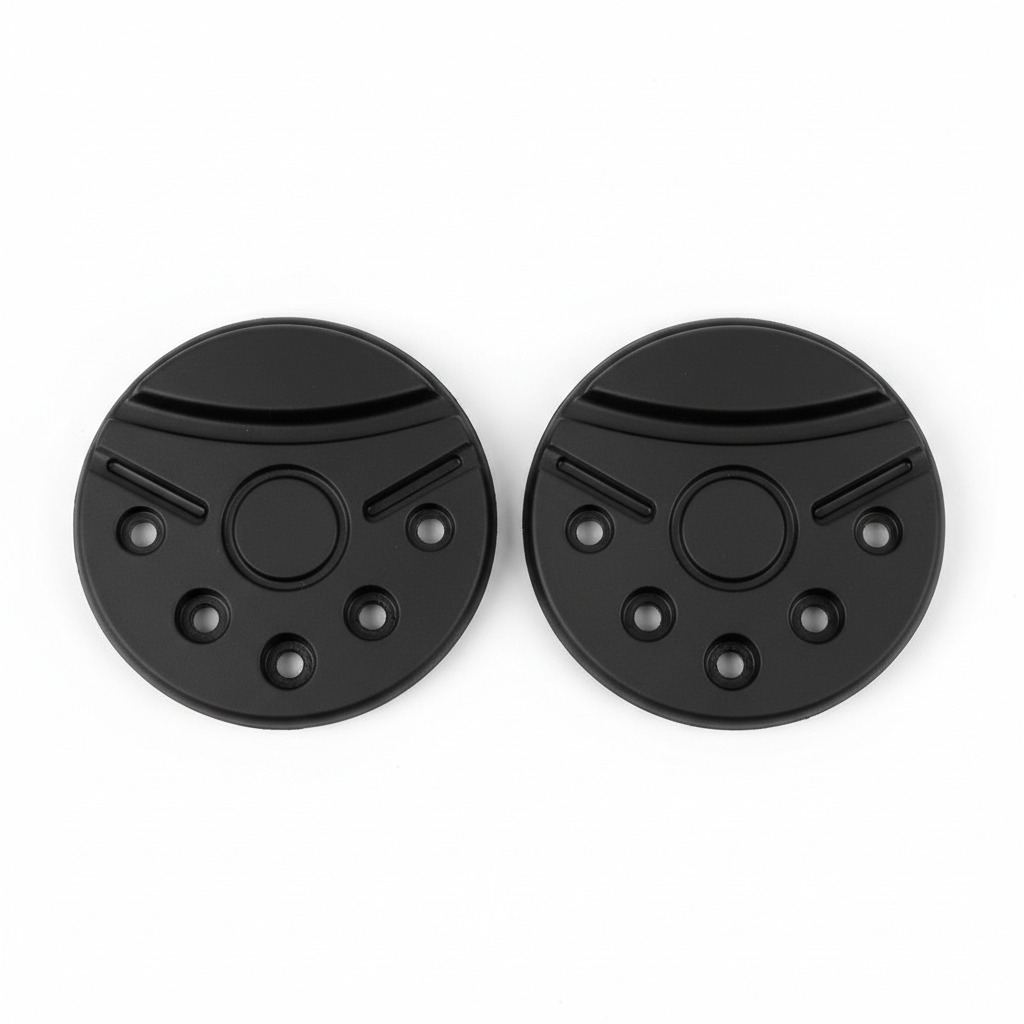 Plain black motorcycle knee slider replacement puck set, overhead flat lay on white background